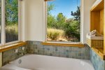 A luxurious bath tub to soak with a view